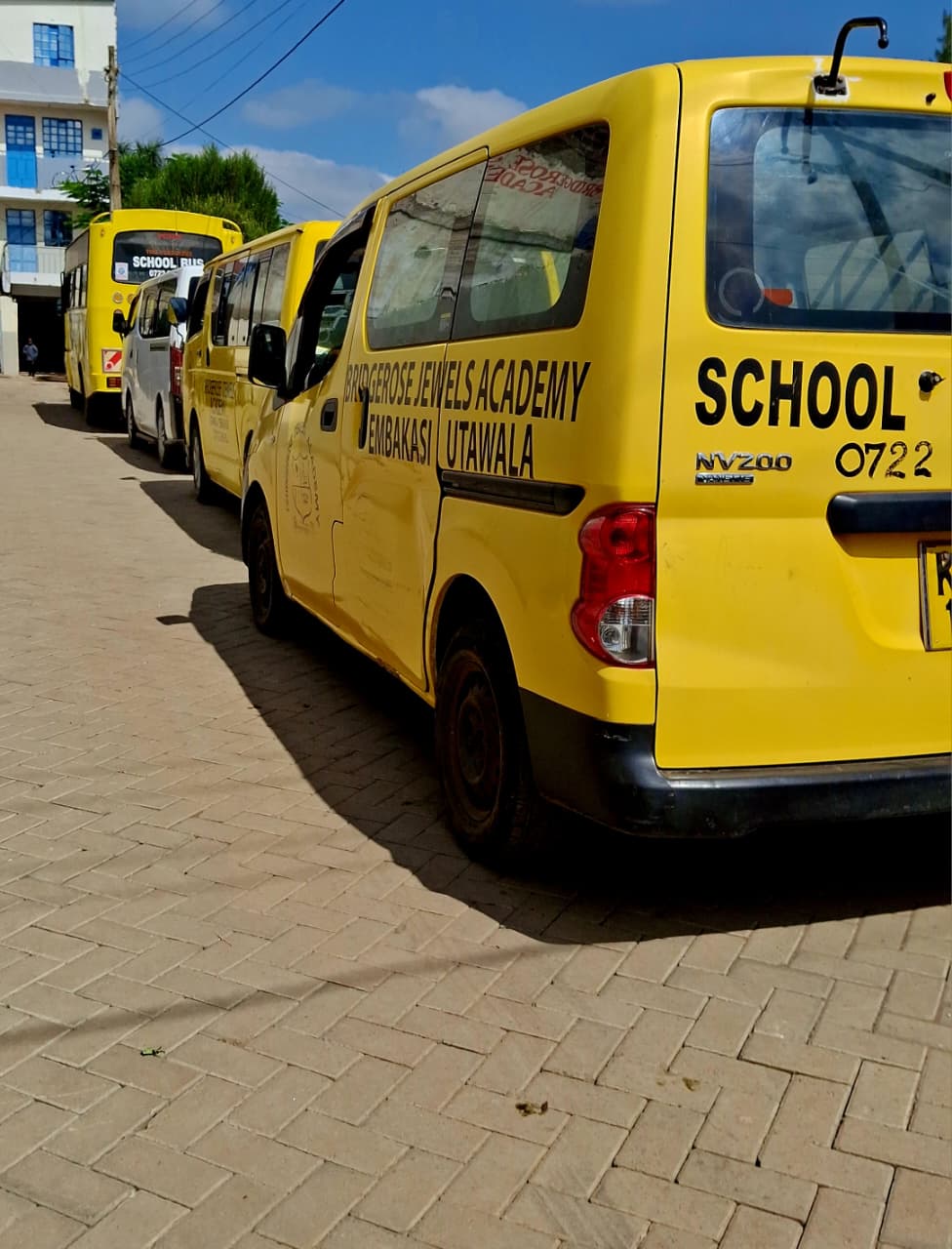 Bridgerose Jewels Academy vans lined up at the campus